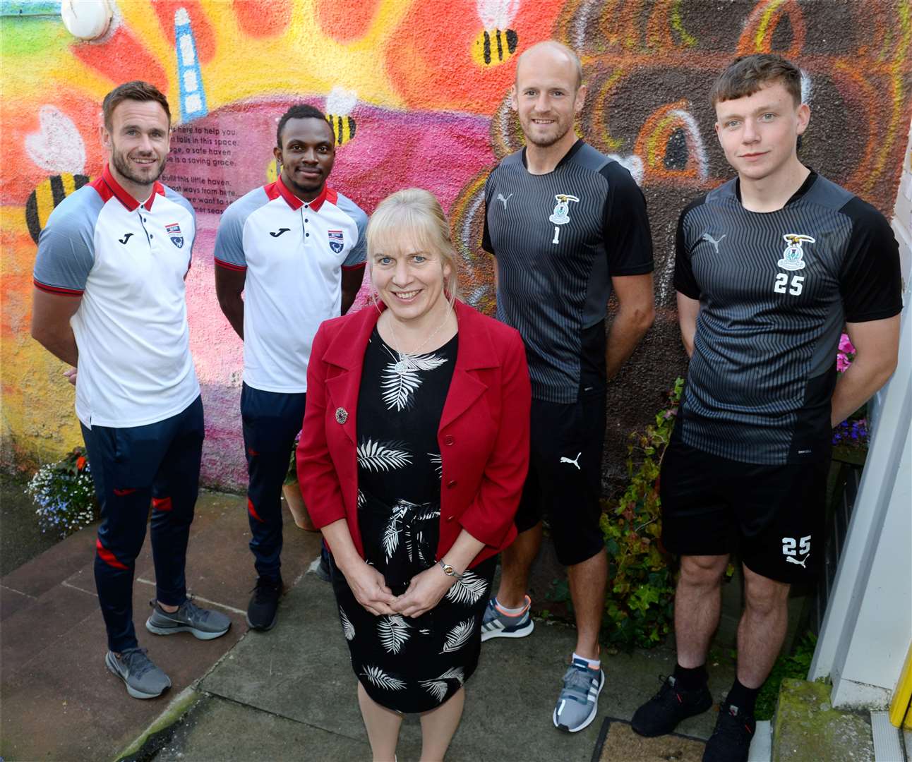 Mikeysline chief executive Emily Stokes and Ross County players Keith Watson and Regan Charles-Cook with Inverness Caledonian Thistle's Mark Ridgers and Harry Nicolson. Picture Gary Anthony.