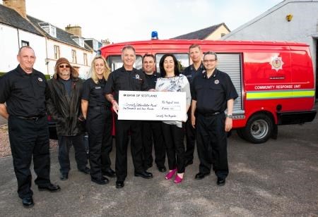Handing over a £1000 cheque to help buy vital medical equipment for Cromarty are local firefighters, from left, Eddie Boardman, community supporter Nigel Shapcott, firefighters Denise MacFarlane and Brian Cameron, crew manager Ronald Young, community coun