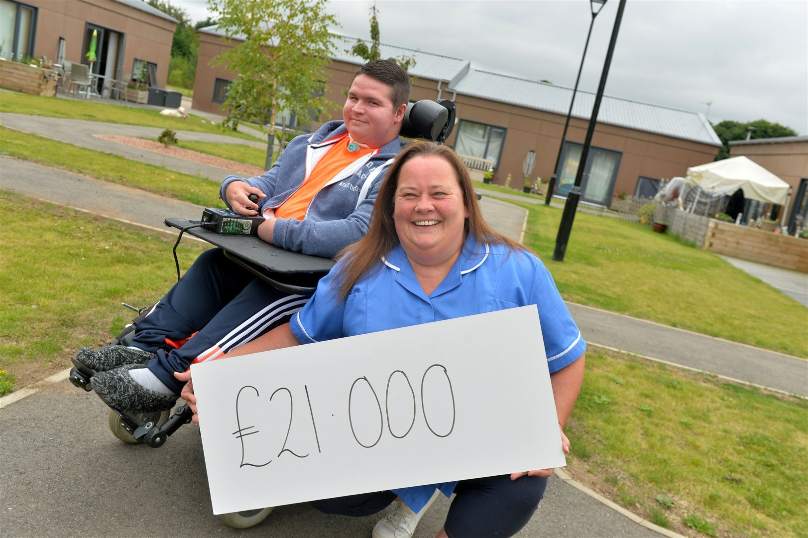 Dylan Bogue and Karen Brownlie pictured when their fundraising push hit a major milestone. Picture: Callum Mackay