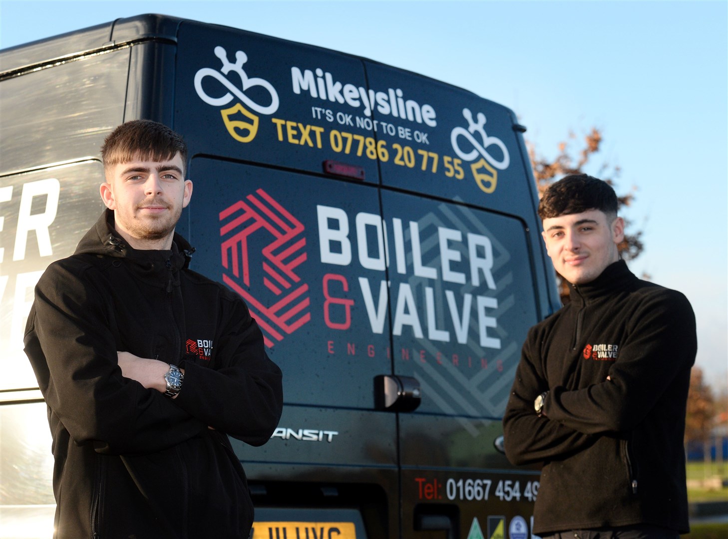 Apprentices Duncan Robertson (left) and Cameron Donnachie with Mikeysline message on the Boiler and Valve van.