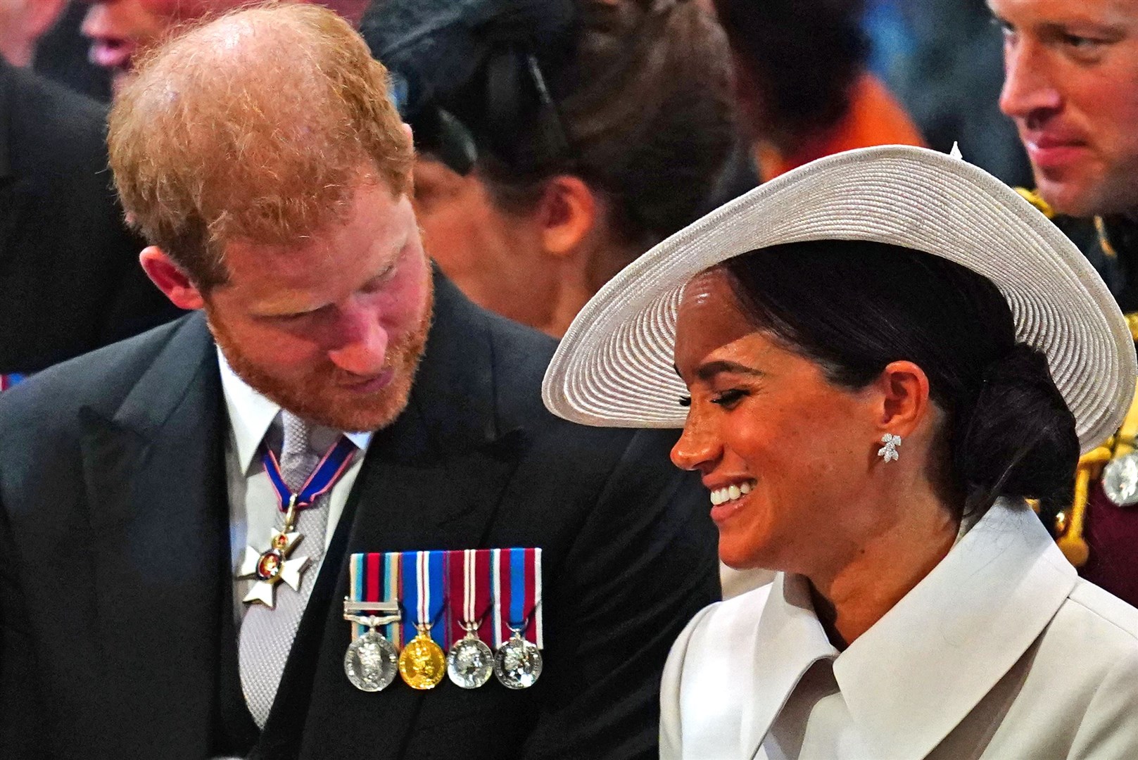 Harry looks at Meghan as she laughs (Victoria Jones/PA)