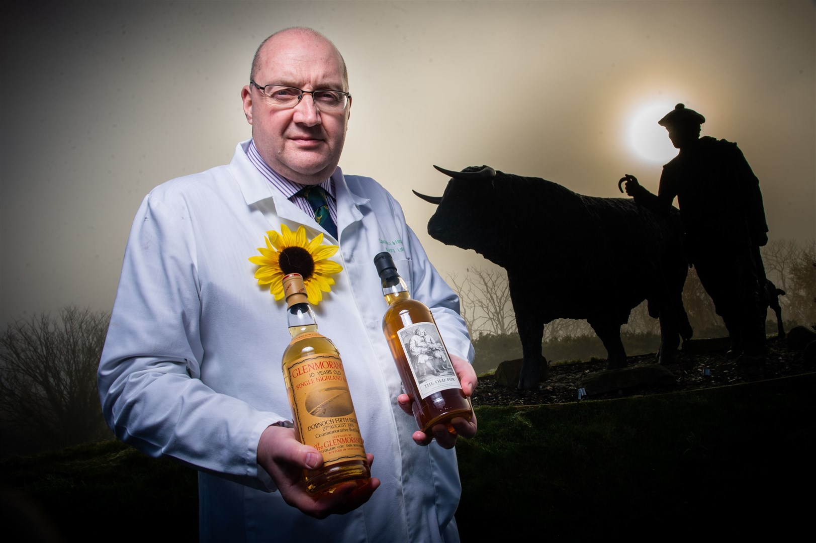 Grant Macpherson, managing director at Dingwall Auction Mart, with a rare bottle of Old Fox whisky which was given by Lovat Estate for the auction along with a Glenmorangie that celebrated the opening of the Dornoch Bridge. Picture: Callum Mackay