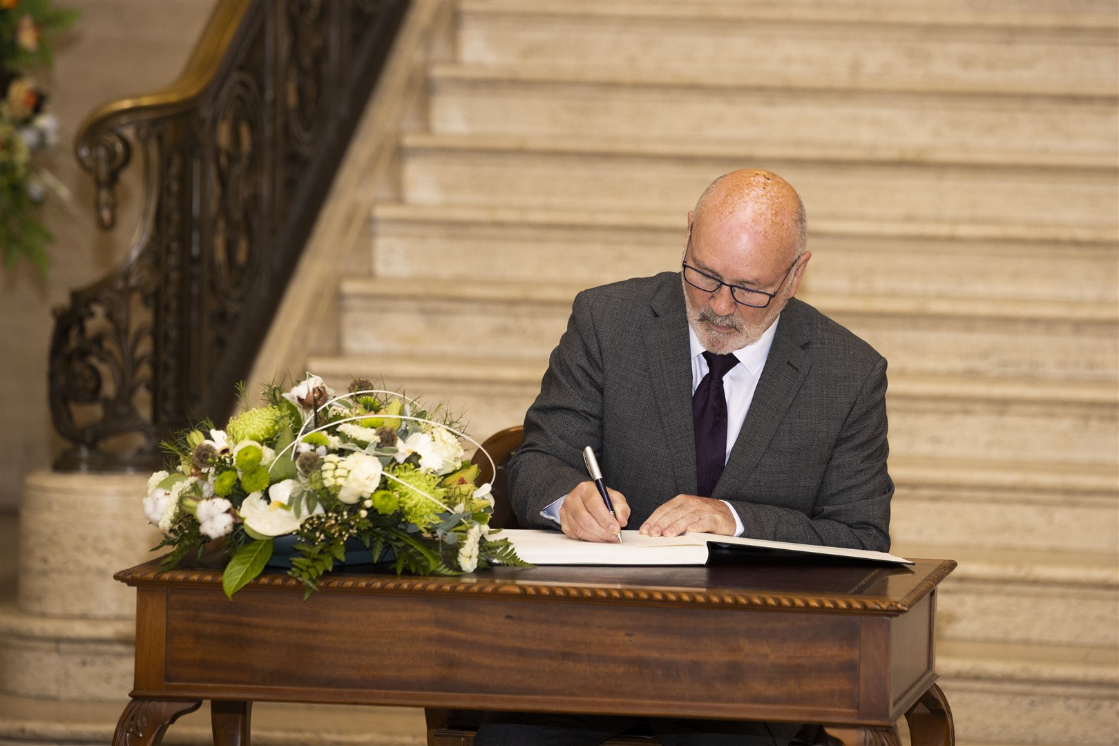 Northern Ireland Assembly Speaker Alex Maskey signing a book of condolence (Liam McBurney/PA)