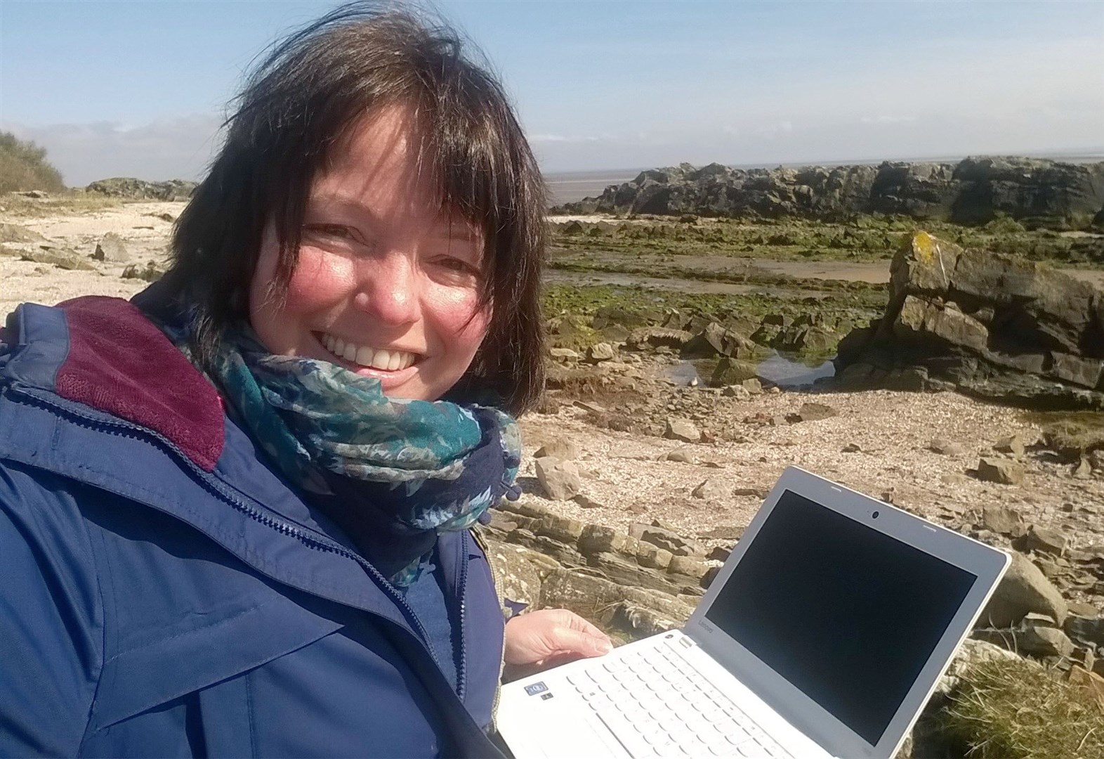 Barbara Henderson on the coast of the Solway Firth researching her latest book.