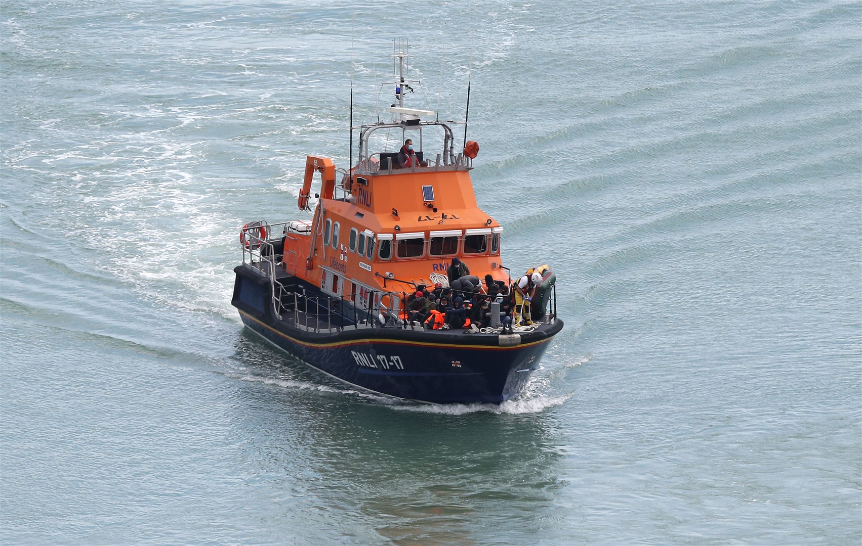 A group of people thought to be migrants are brought into Dover, Kent, by the RNLI following a small boat incident in the Channel (Andrew Matthews/PA)