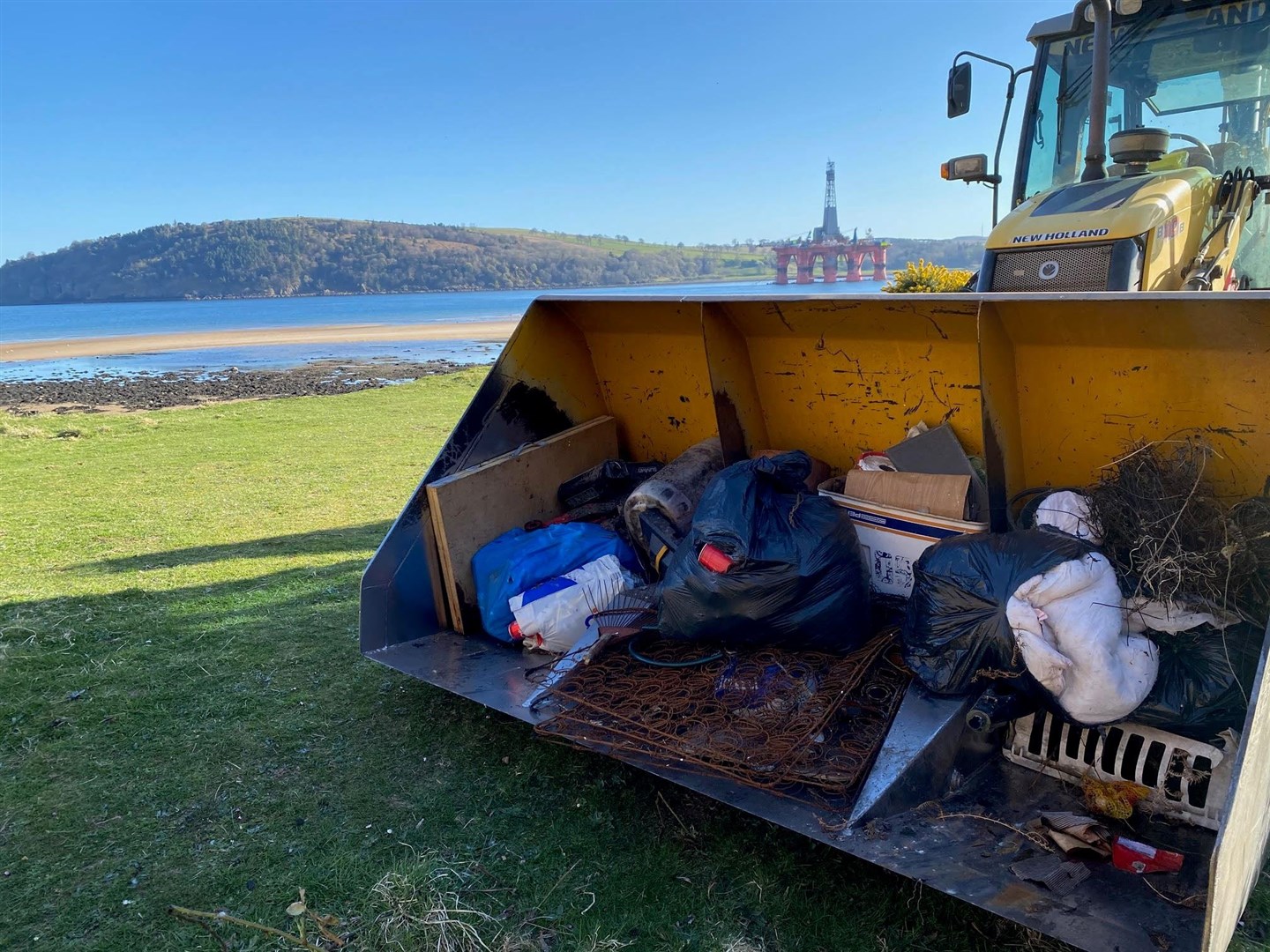 A bucketload of flytipped rubbish collected this week at Nigg, next to a nature reserve that enjoys protected status. The Cromarty Firth, in the background, is also a Site of Special Scientific Interest.