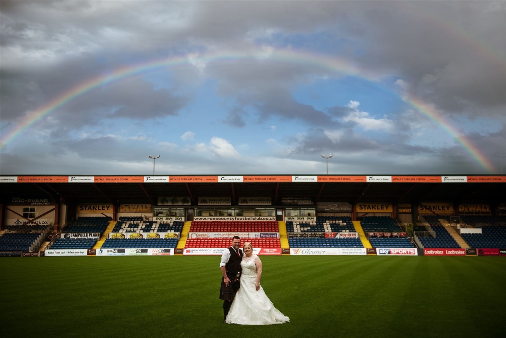 Kenny and Amy MacLennan blessed by a rainbow on their big day. Picture: Michael Carver.