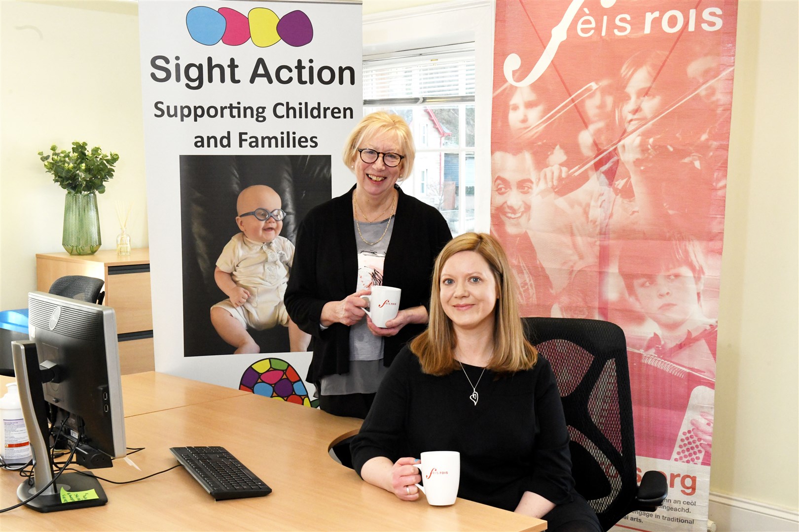 Sharing office space looks set to prompt a collaboration between Gillian Mitchell, Sight Action executive manager and Fiona Dalgetty, Feis Rois chief executive. Picture: James Mackenzie.