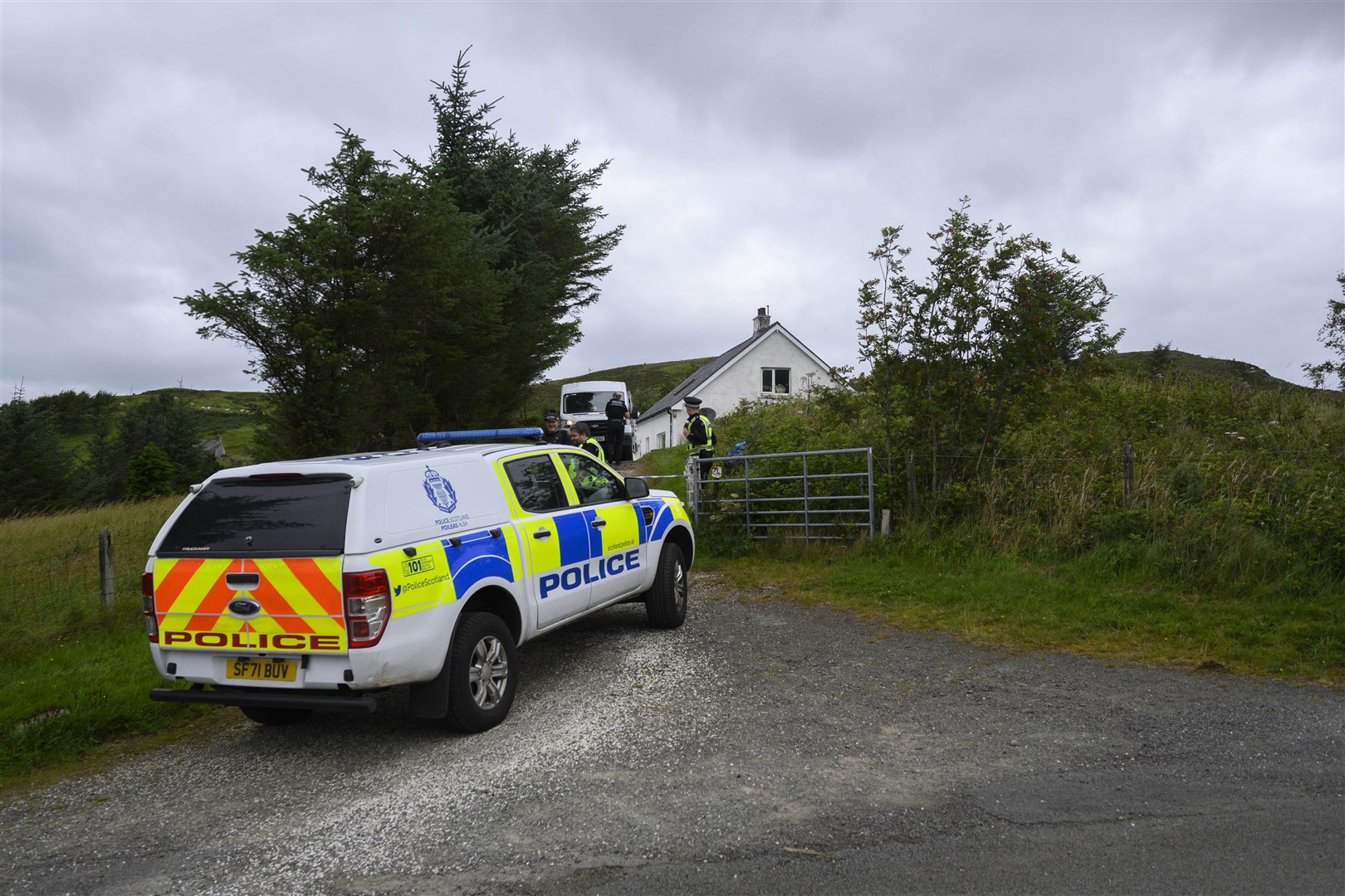 Police at the scene of the incident in Tarskavaig, a crofting village on the Isle of Skye (John Linton/PA)