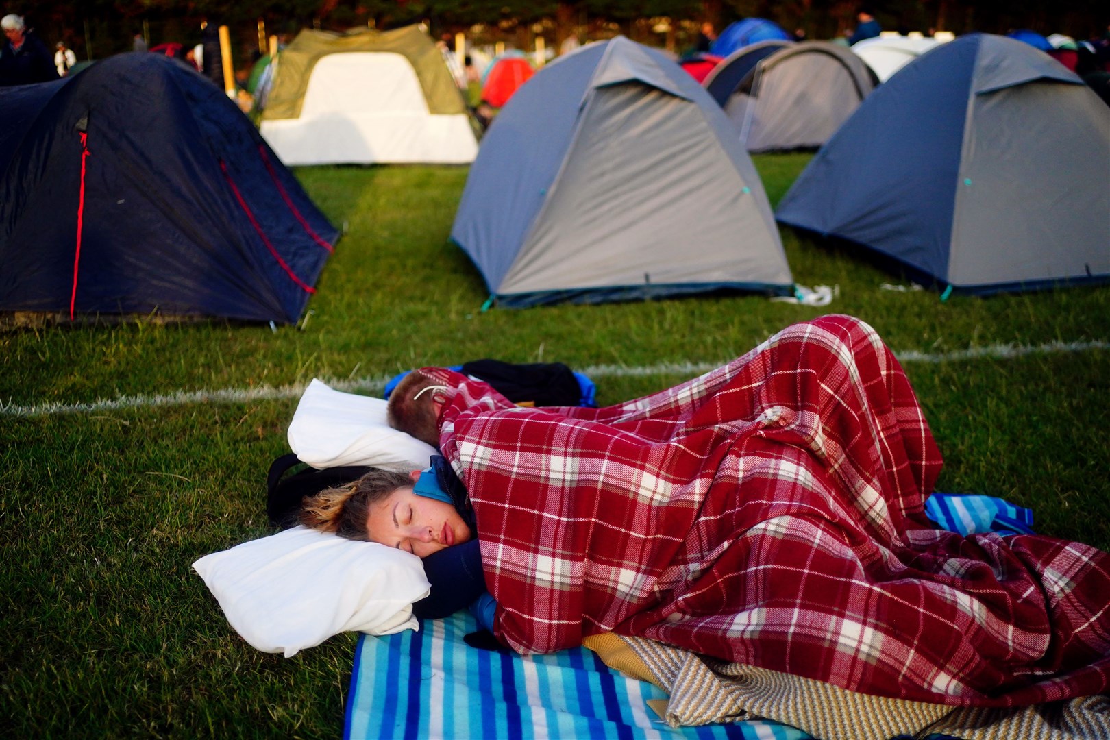 Tennis fans have been camping overnight to be at the front of the queue (Victoria Jones/PA)