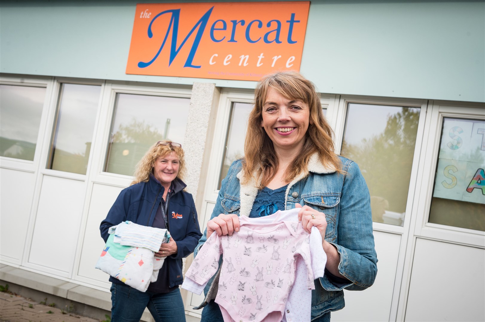 Dawn Aird of Kildary is organising a collection of baby clothes for a children's hospital in Yemen. She's pictured with Mercat Centre manager Mairi Crow. Picture: Callum Mackay
