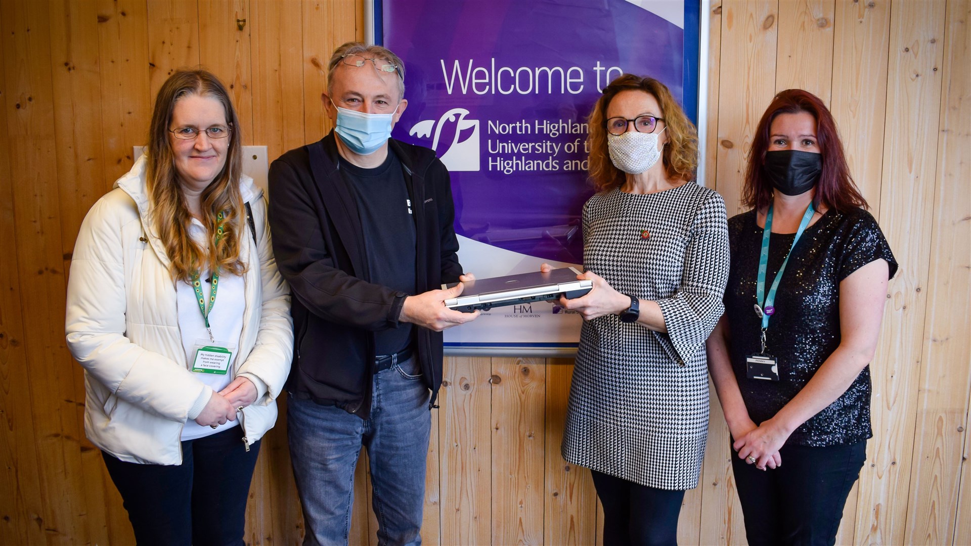 Budding Engineers directors Liz and Dave Kerr accept the first donation of redundant IT equipment from North College UHI principal Debbie Murray, and PA to the principal Penny Gunn.