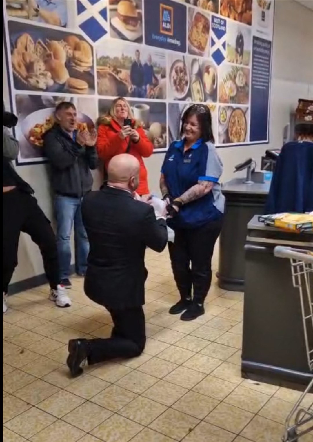 Mike proposing to Lynne at Aldi.