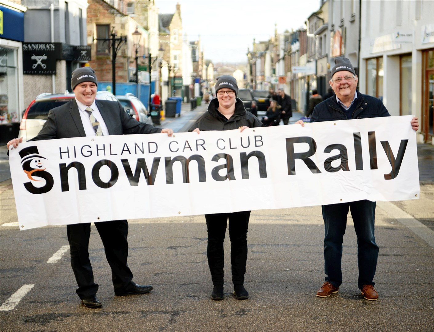 Gavin Kelt, Snowman Rally committee member, Tracy Smith, secretary of the Highland Car Club and councillor Graham Mackenzie get the message across. Picture: James MacKenzie