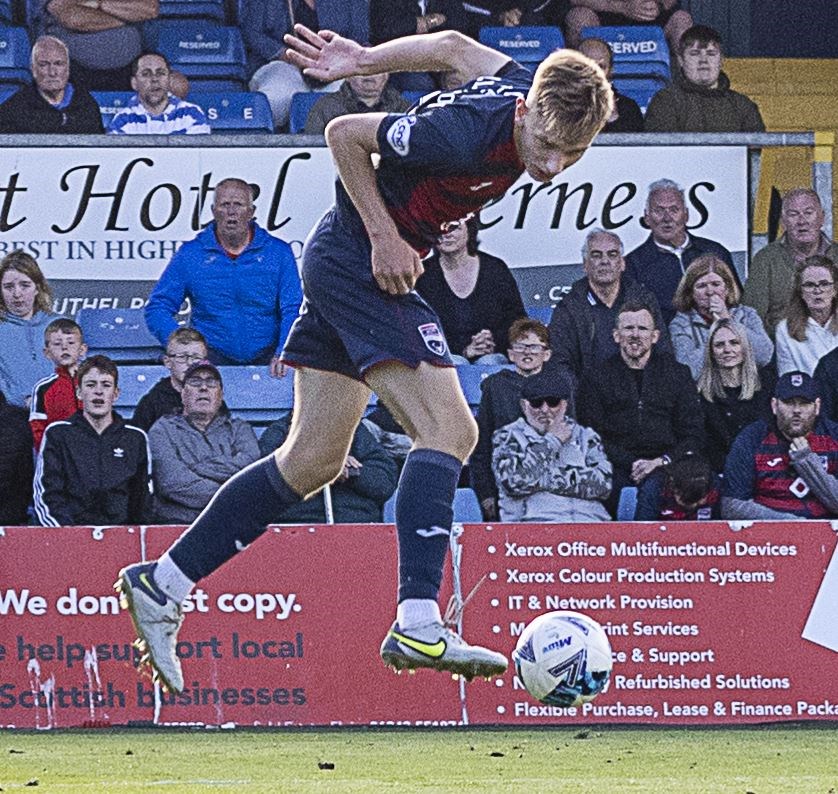Ross County's Jamie Williamson heads for goal. Picture: Ken Macpherson