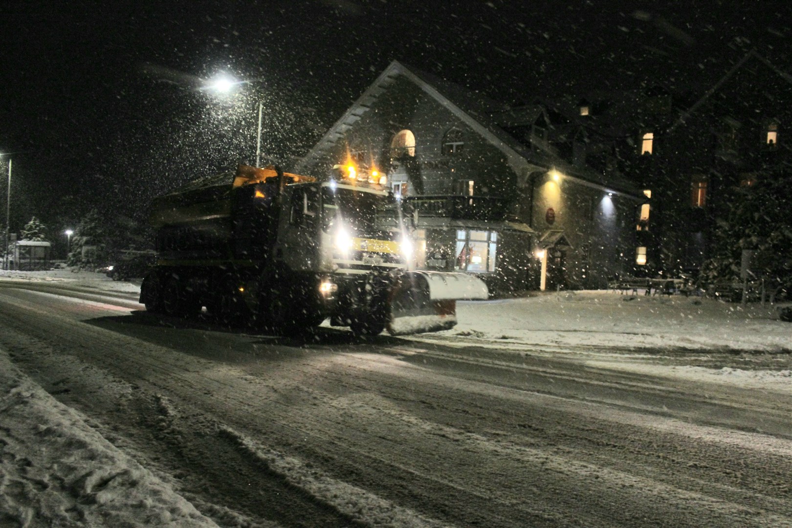 A gritter ploughs through Kingussie during a previous winter.