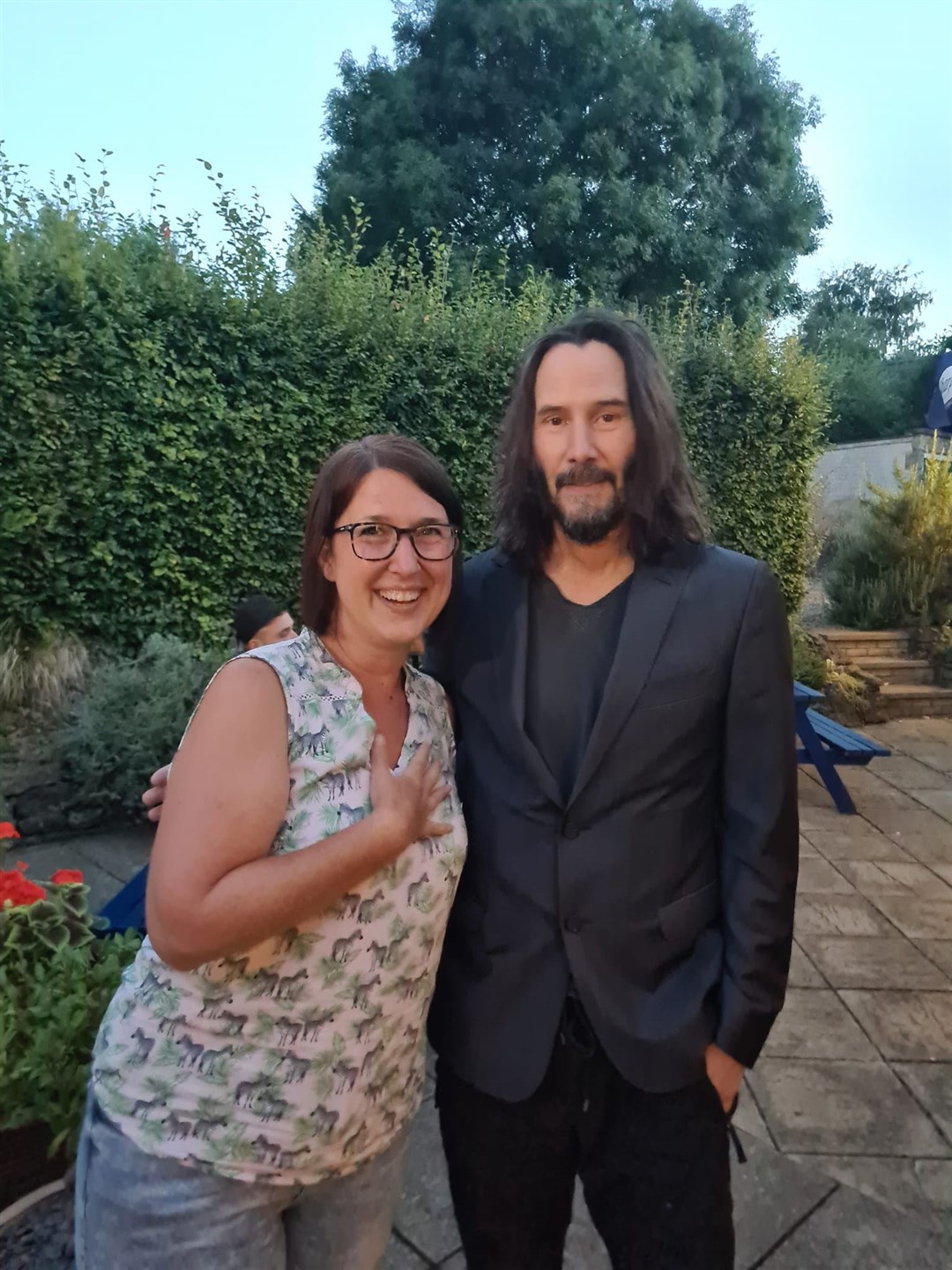 Dianne King, 46, poses with film star Keanu Reeves at her local pub (Dianne King/PA)
