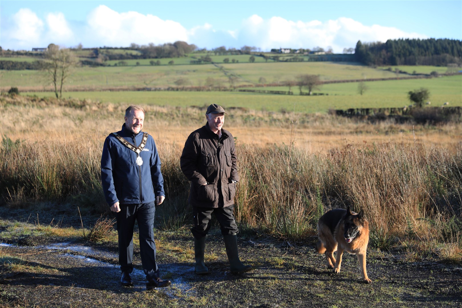 Stewart Hood, right, talks with Mayor of Antrim and Newtownabbey Alderman Stephen Ross on his land in Antrim where he has planted 20,000 trees (Peter Morrison/PA)