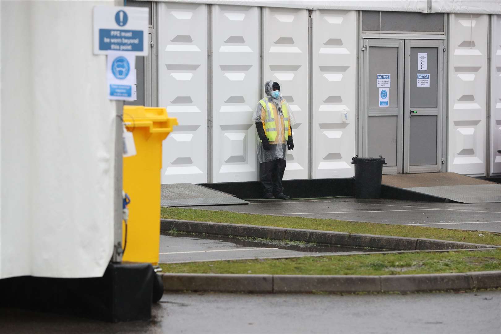 Security staff at the overflow mortuary at Breakspear Crematorium in Ruislip, London (Jonathan Brady/PA)