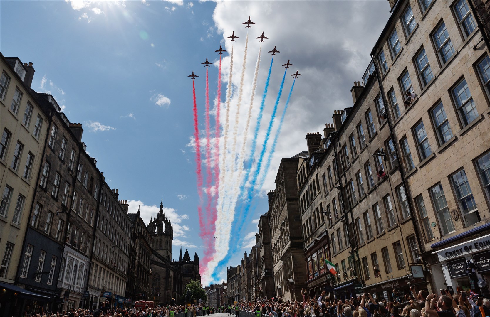 People watch a Red Arrows flypast (Colin Mearns/Herald & Times Group/PA)