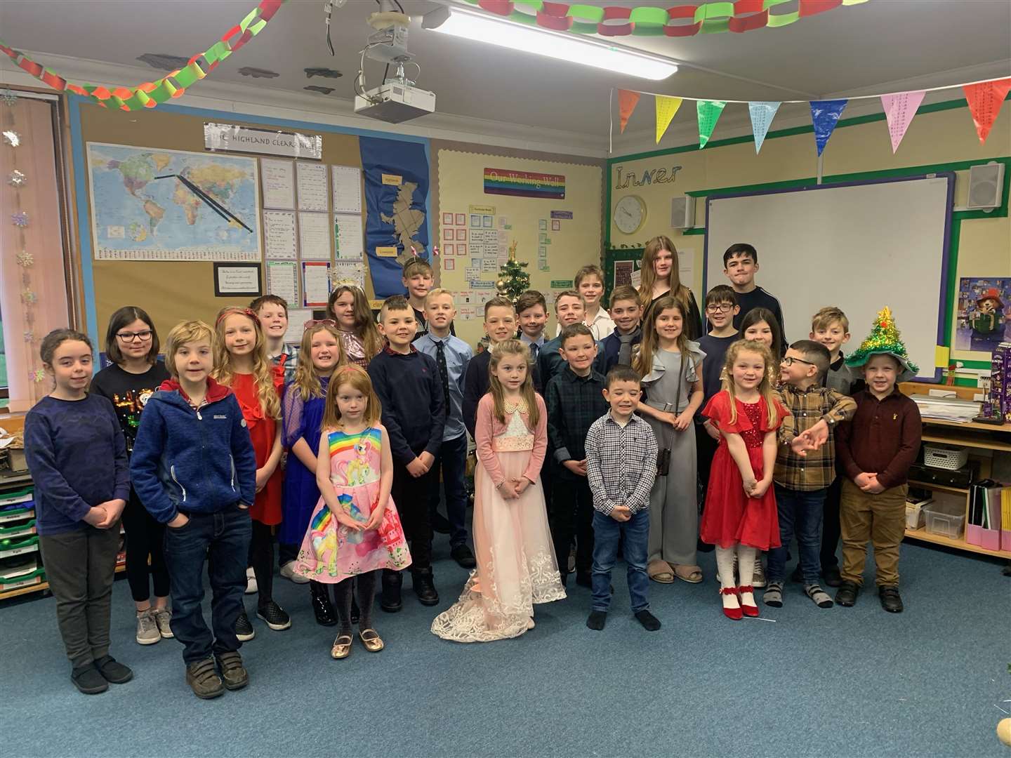 Children from Inver Primary School singing carols. Their performance was videoed and shared on the Inver community Facebook page for all the parents and friends to see.