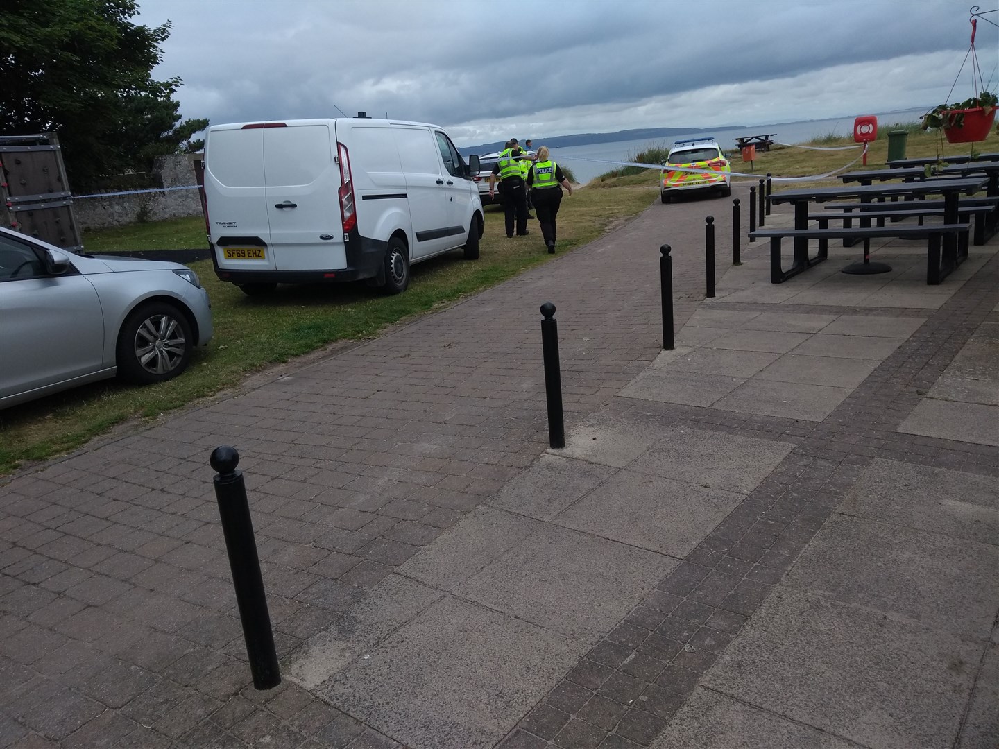Police at the scene where the body was found in Nairn.