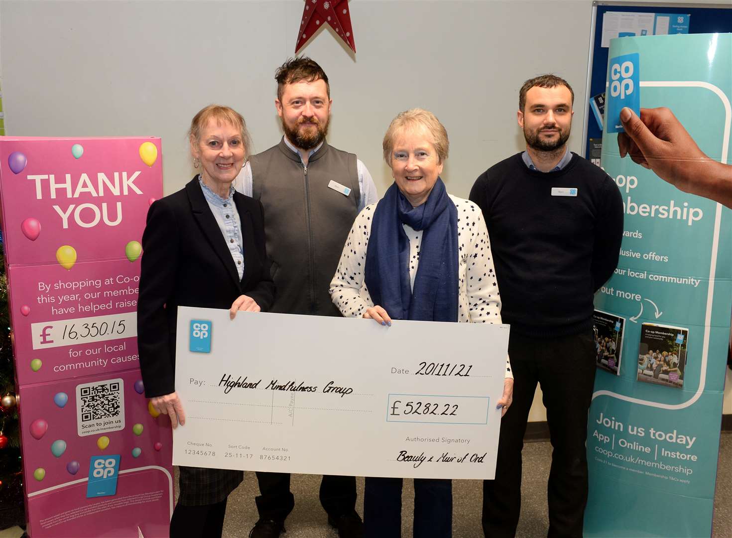 Kate Boyd and Christine Beck receive £5282.22 from Neil Morrison and Neil Cameron of Co-op for Highland Mindfulness Group. Picture Gary Anthony