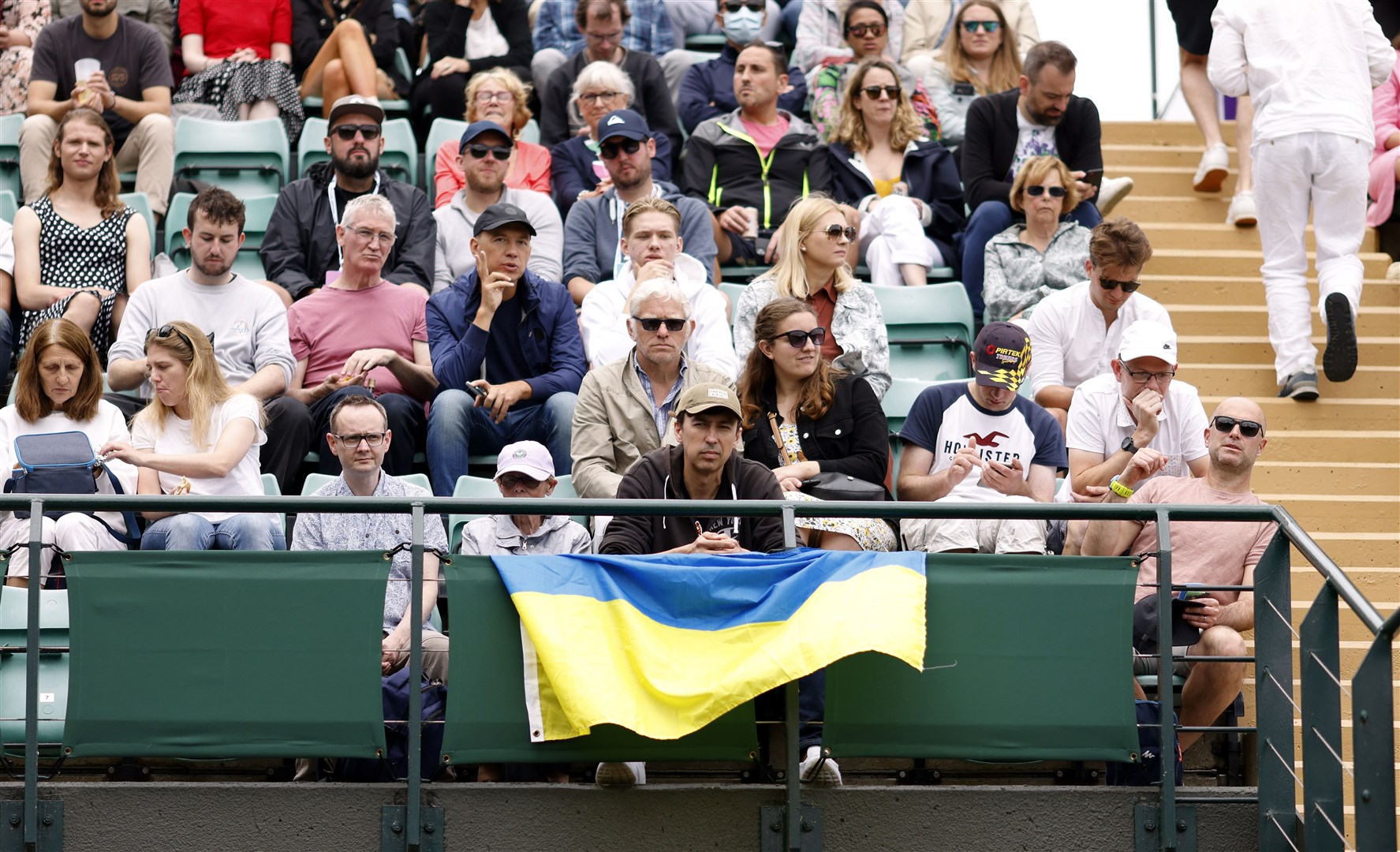 A Ukraine flag in the stands as Lesia Tsurenko plays her ladies’ singles first round match against Jodie Burrage (Steven Paston/PA)