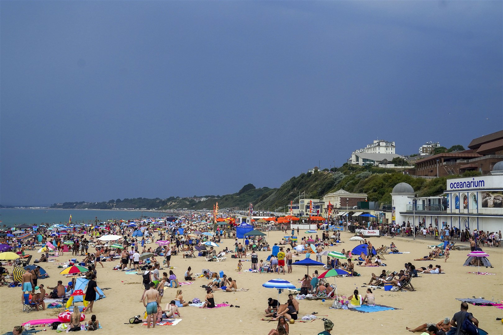 In stark contrast, Britain’s beaches – including here in Bournemouth – provided a cool haven for many over the summer, as a heatwave saw temperatures in some places top 40C (Steve Parsons/PA)