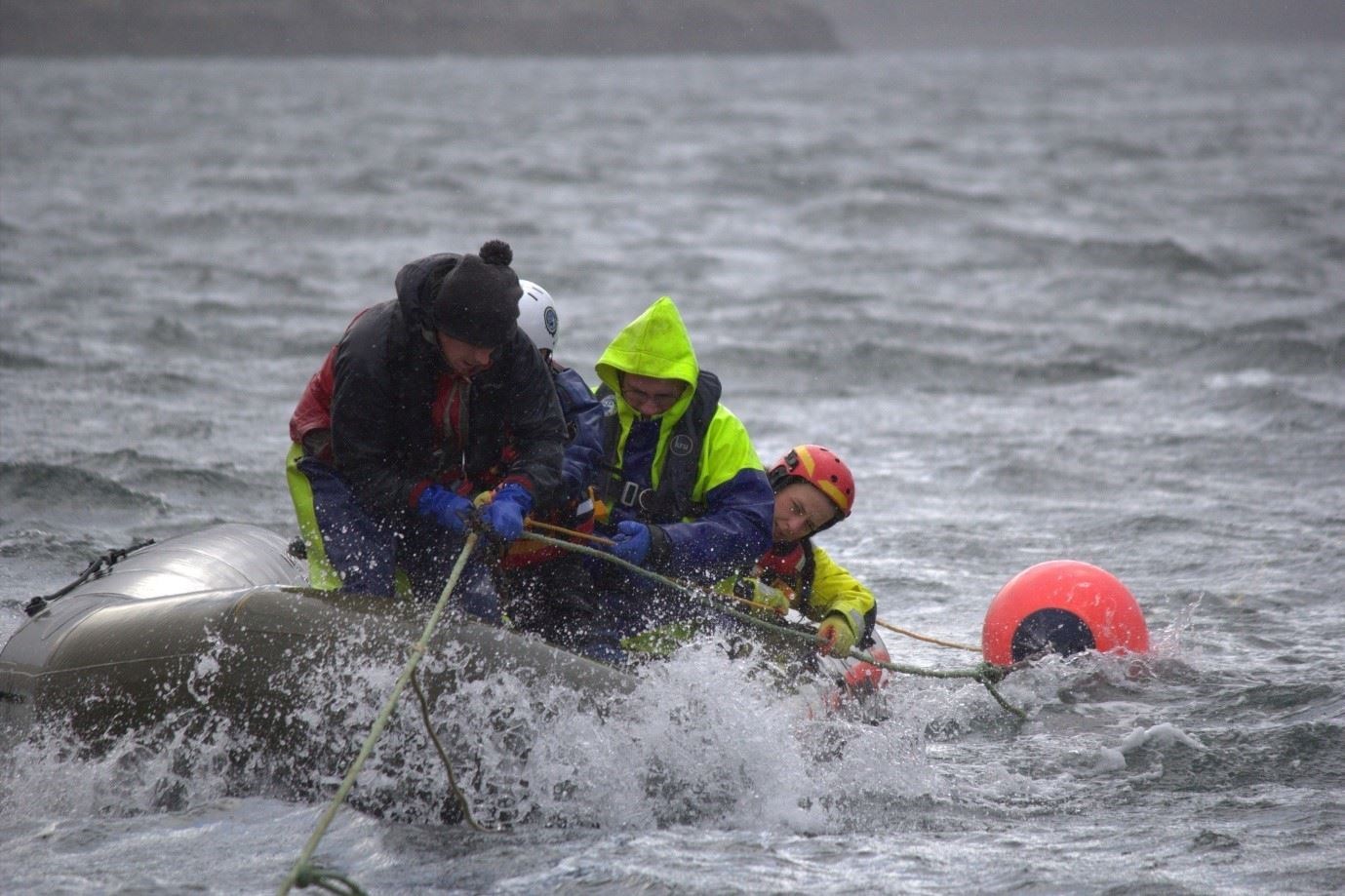 Fishermen and BDMLR disentanglement team members on Loch Broom practising the Nantucket Sleighride, a technique originally developed by whalers and adapted to safely attach to and approach an entangled whale in order to disentangle it. Picture: Scottish Entanglement Alliance (SEA).