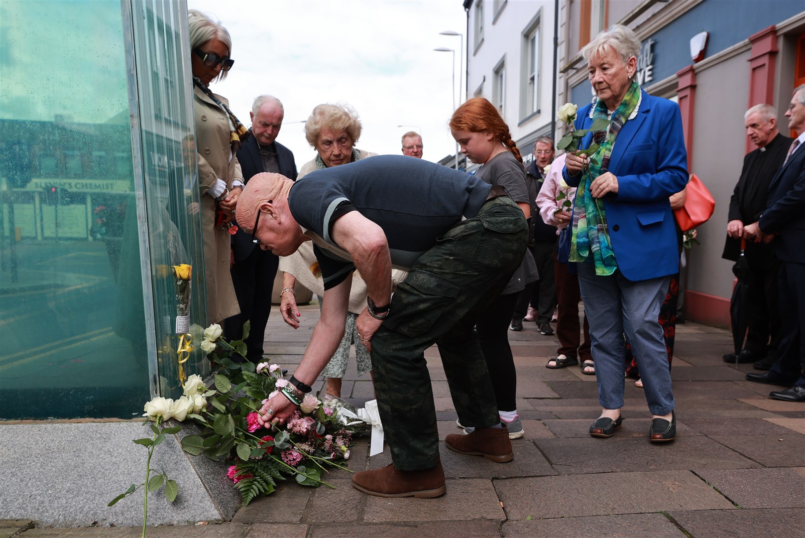 Kevin Skeldon who’s wife Philomena died in the Omagh bombing lays flowers at the site of the bombing (Liam McBurney/PA)
