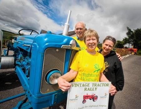 Margaret Somerville (front) is accompanied by Neil MacDonald, organiser of the tractor rally, and Katie Gibb of Highland Hospice. Picture: Ian Rhind.