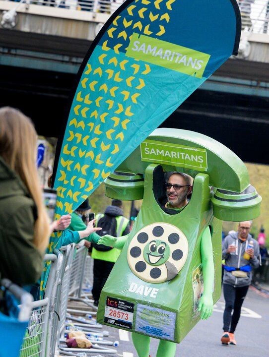 Dave Lock in his telephone costume while running the 2023 TCS London Marathon for Samaritans (Anthony Upton/Samaritans/PA)