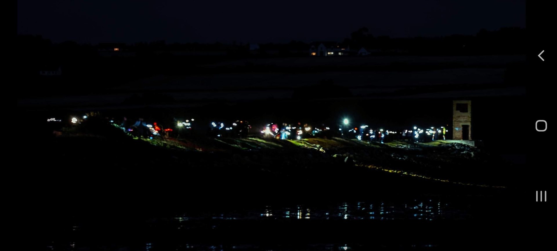 Lights of hope in the dark: The Alness event at the Yankee pier attracted a great turnout. Picture: Paul Morley