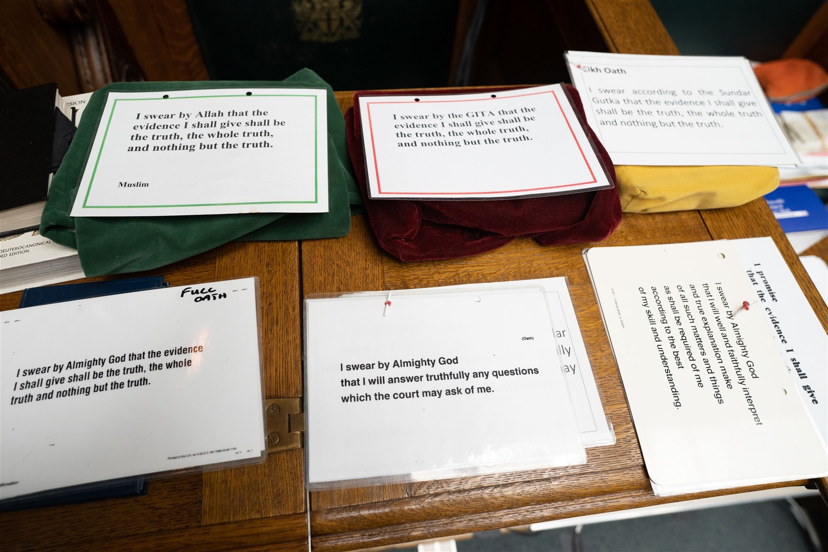 The oath cards used when witnesses and defendants are sworn in (Stefan Rousseau/PA)