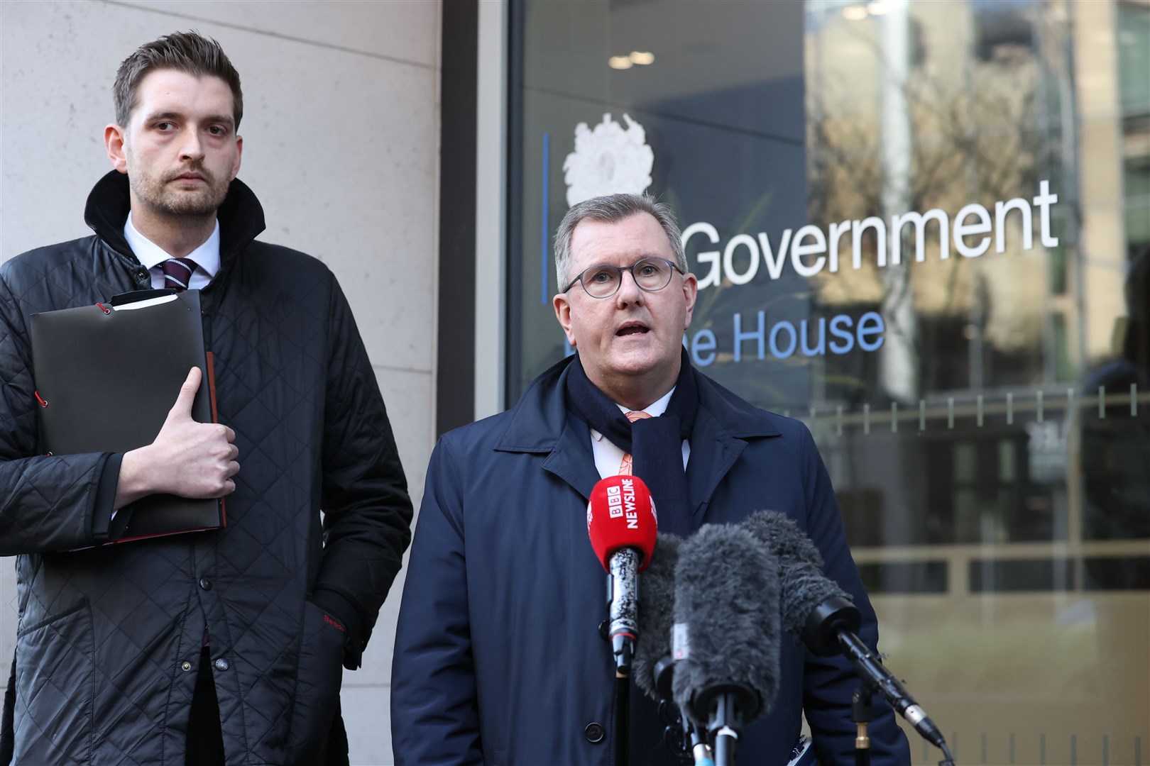Leader of the DUP Sir Jeffrey Donaldson MP, with Phillip Brett, speaking to the media outside Erskine House, Belfast in Northern Ireland, following a meeting with Northern Ireland Secretary Chris Heaton-Harris (Liam McBurney/PA)