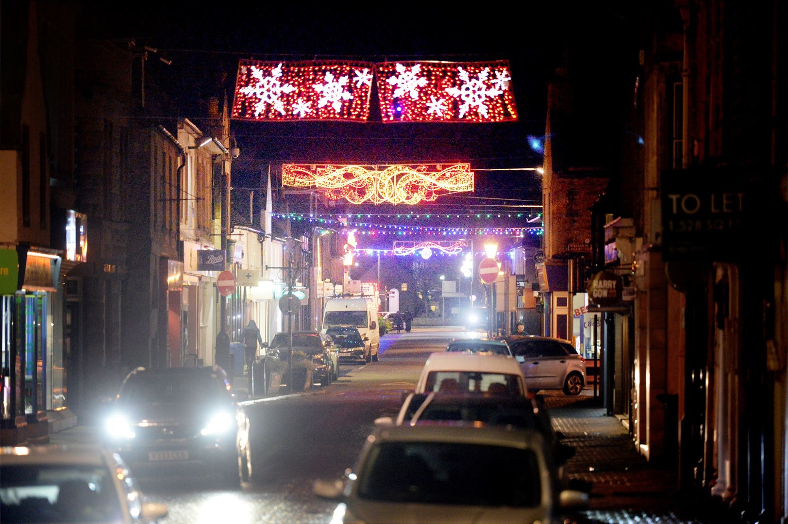 Dingwall High Street's festive lights reflect the hope of better times ahead. Picture: James Mackenzie
