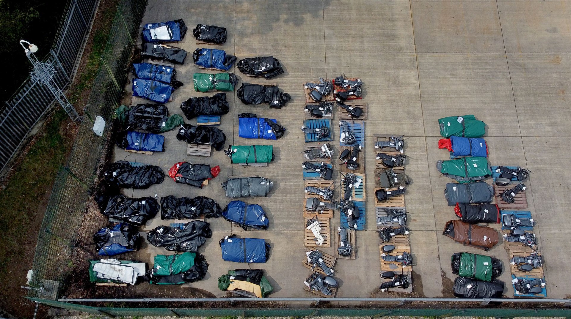 Small boats and engines in storage after being used to cross the Channel (Gareth Fuller/PA)