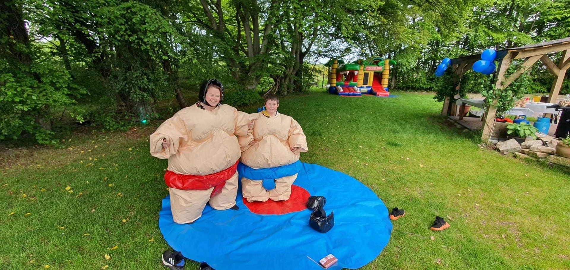 Conon Hotel first anniversary fun day: hotel manager Louise MacPhee and her son Max in sumo suits.