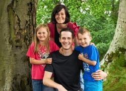 Dr Jonathan Mackenzie, pictured with his family, has been named student of the year