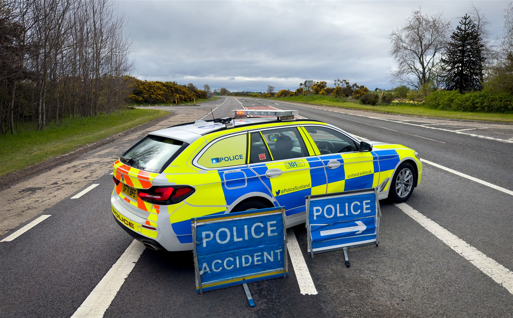 A police patrol stops traffic on A9 south of Cromarty Bridge.