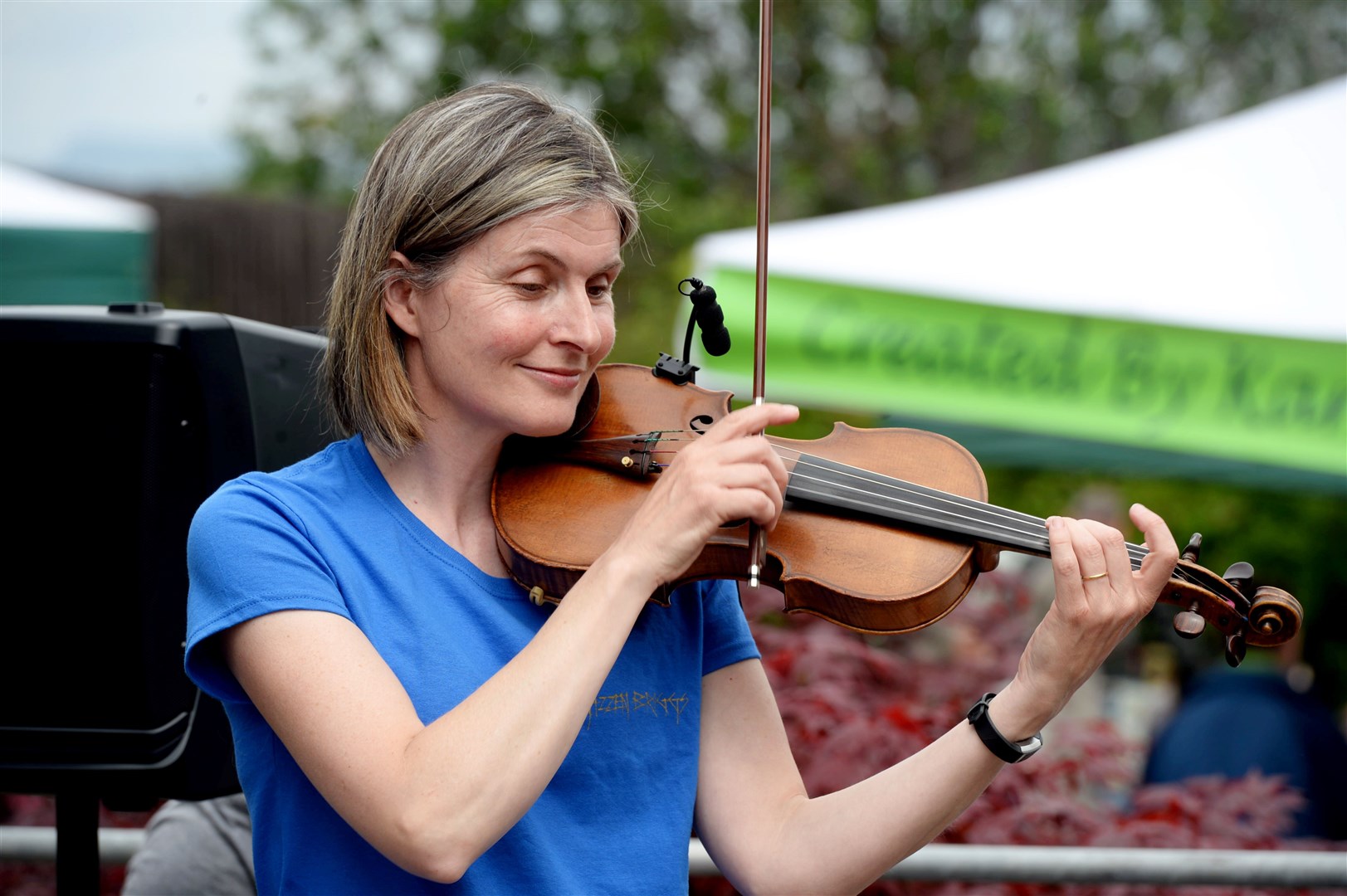 Debbie Ross performing with Gizzen Briggs at an outdoor market in Tain. Picture: James Mackenzie