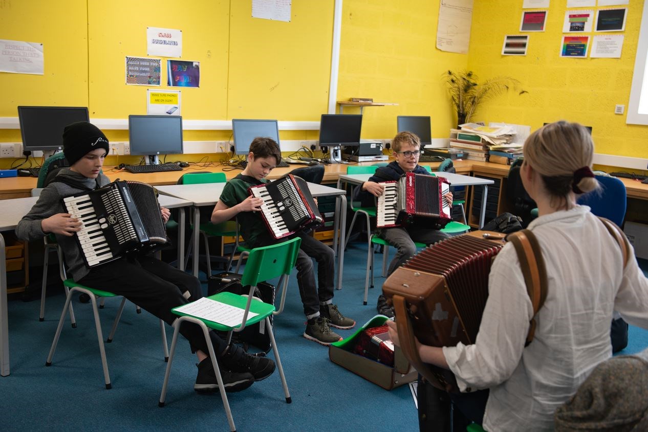Fèis Rois accordion class tutor, Amy Henderson, and three of her students.