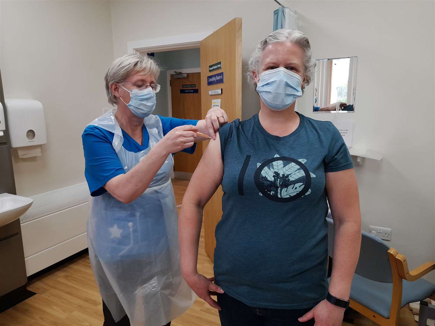 Dr Moira McKenna vaccinates a patient from Dingwall Medical Group at an earlier clinic.