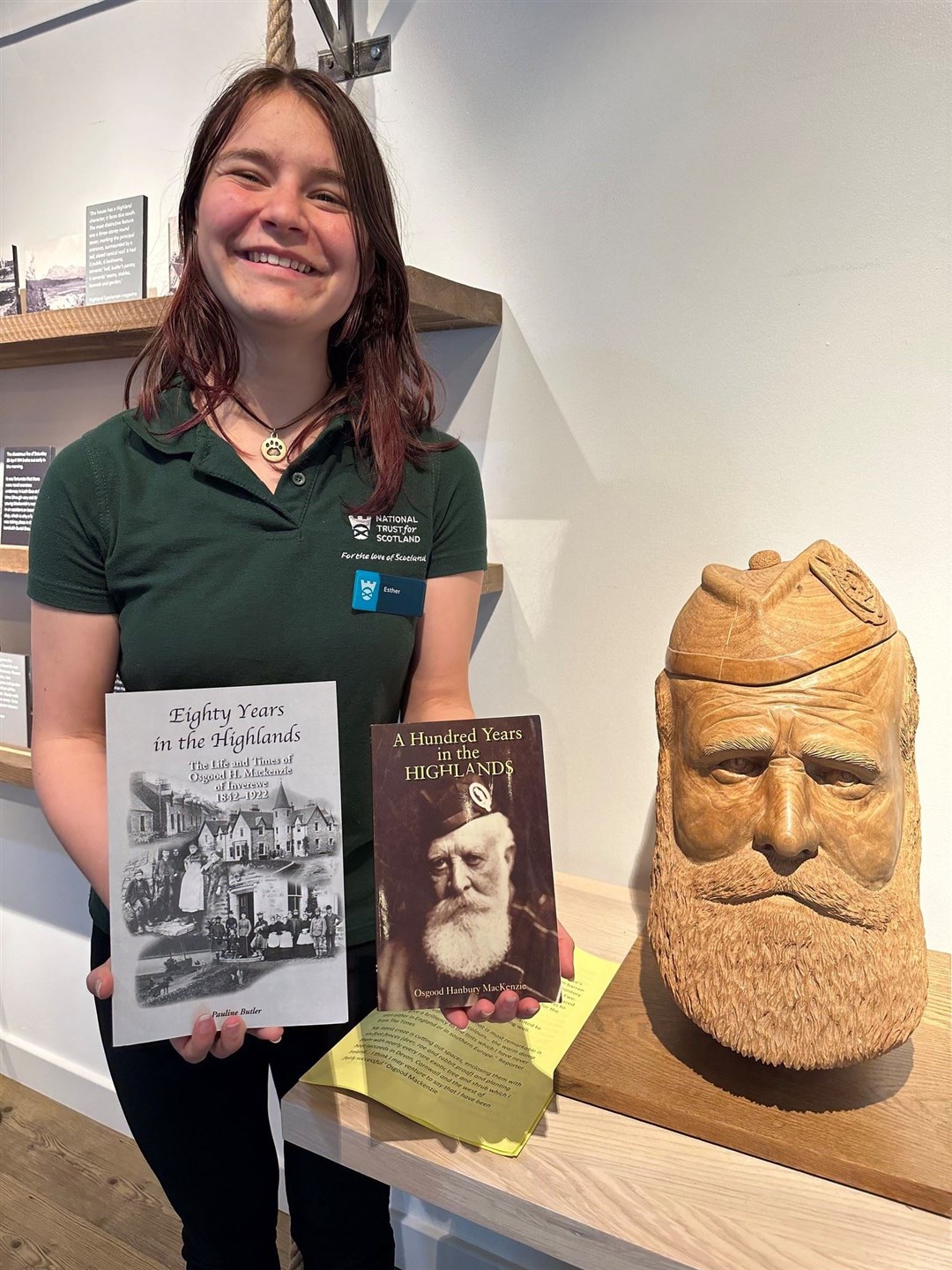 Esther Pennington, a member of NTS staff at Inverewe, with the books which helped inspire the play.