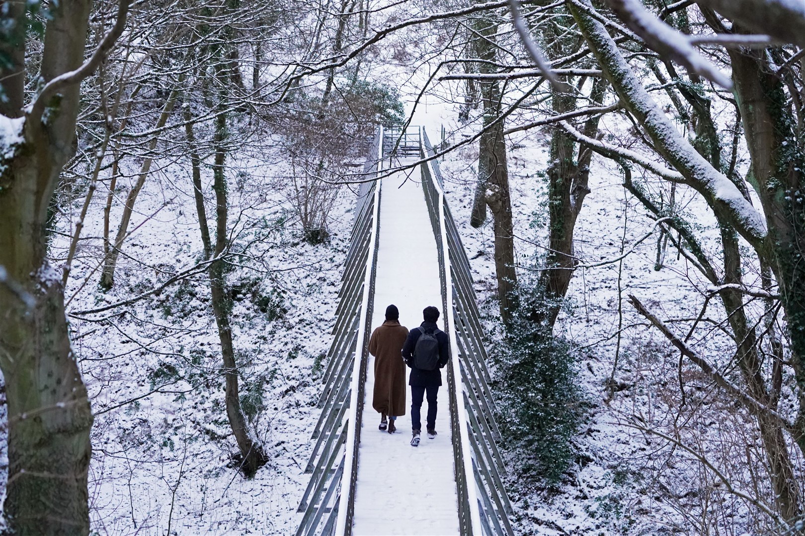 Walking through the snow at Pelaw Wood in Durham (Owen Humphreys/PA)