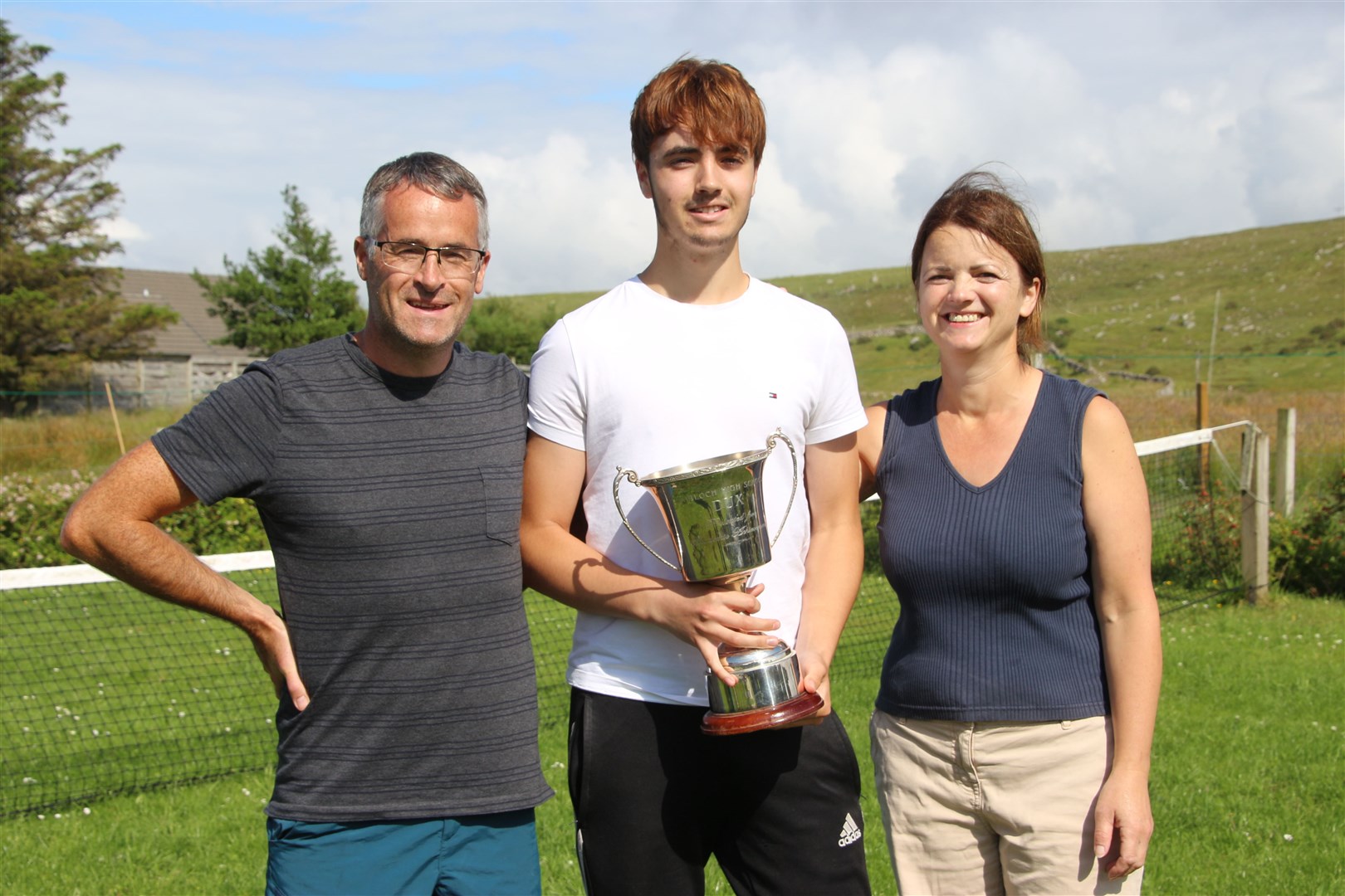 Eoin Cumming, named school Dux, with parents Iain and Maureen Cumming at their home in Laide. He was praised for his hard work and dedication, which was always rewarded with several music prizes.