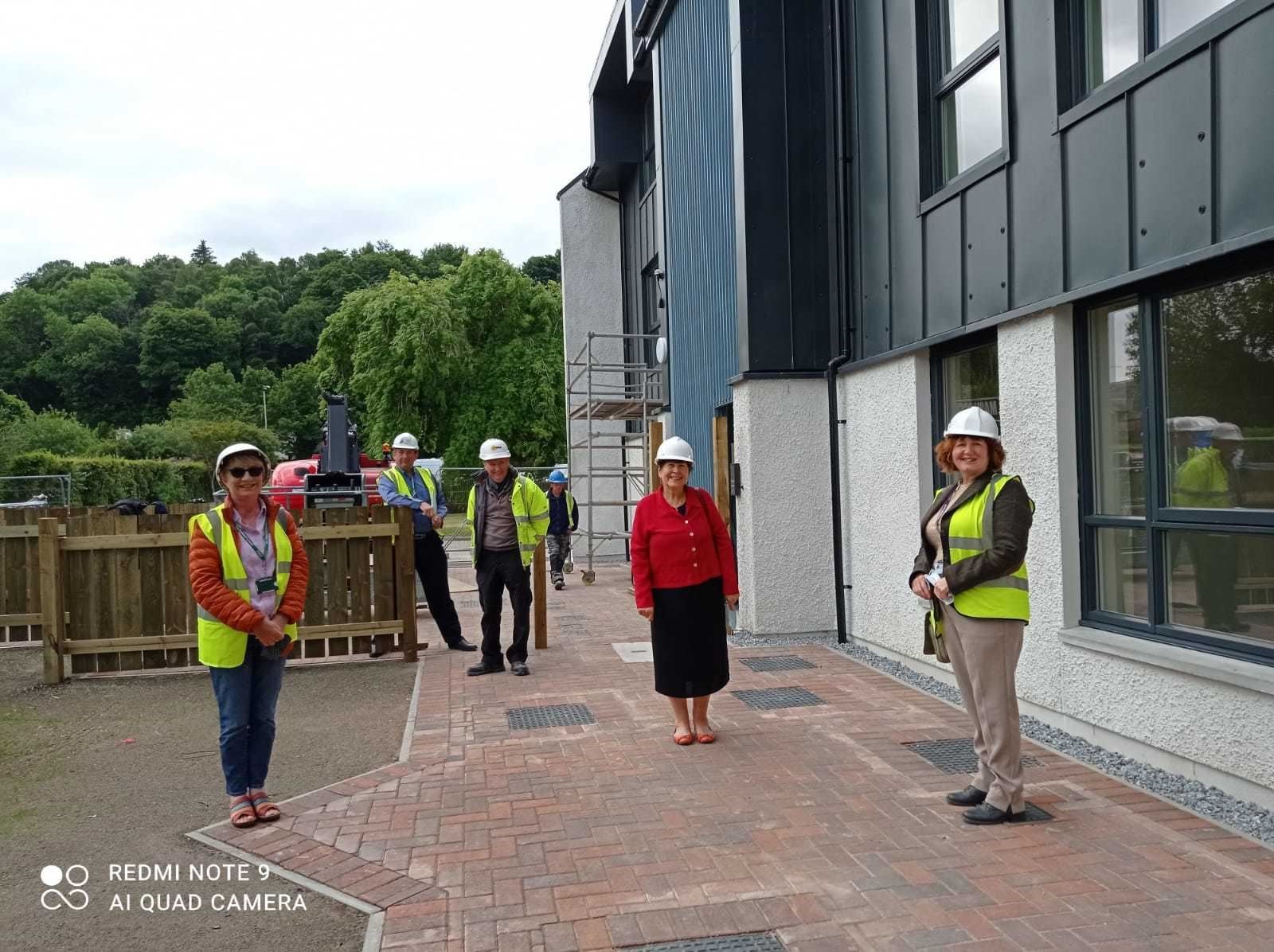 Councillor Margaret Paterson (centre) and Cllr Angela Maclean (right) view the newly completed homes at Joe Yates Court in Dingwall.