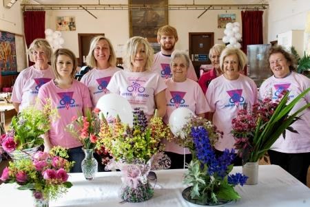 The Evanton Flower and Croft Show volunteers who raised cash in support of Carol Bruce (fourth from left) who will take part in a 350km charity cycle ride in east Africa in October. Picture: Ian Rhind