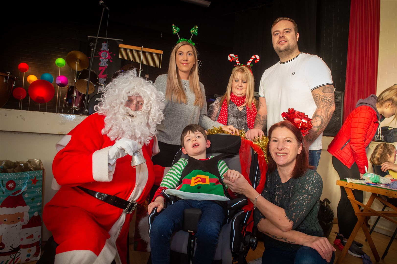 Reece and Donna Mitchell (front) at the latest event to raise funds for a specialist £60,000 care pod for the youngster. Picture: Callum Mackay